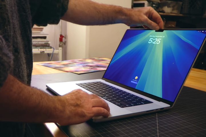 A person using the M4 MacBook Pro.