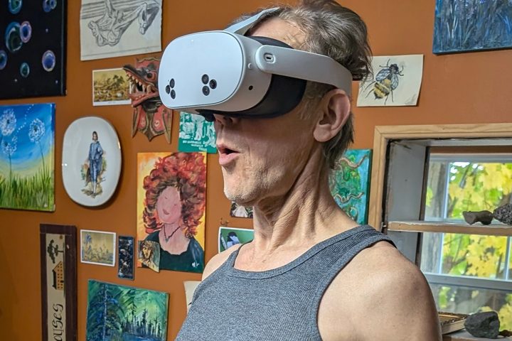 Alan Truly reacts to an exciting VR scene while wearing a Quest 3S.