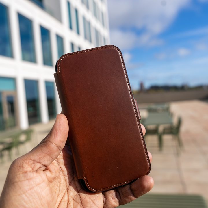 Nomad Leather Folio case closed in the hand