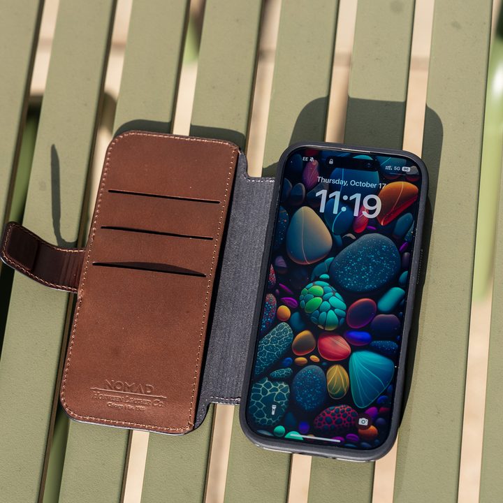 Nomad Leather Folio case for iPhone 16 Pro on a table