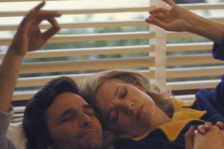 Peter Falk and Gena Rowlands lie next to each other in A Woman Under the Influence.