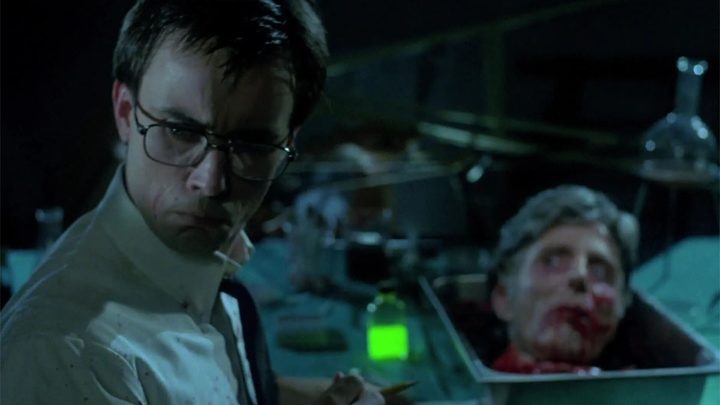 Jeffrey Combs and the severed head of David Gale in Re-Animator.