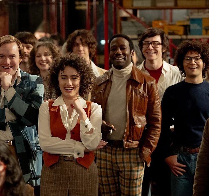 Several actors pose Saturday Night Live-style for the camera in a still from the movie Saturday Night.