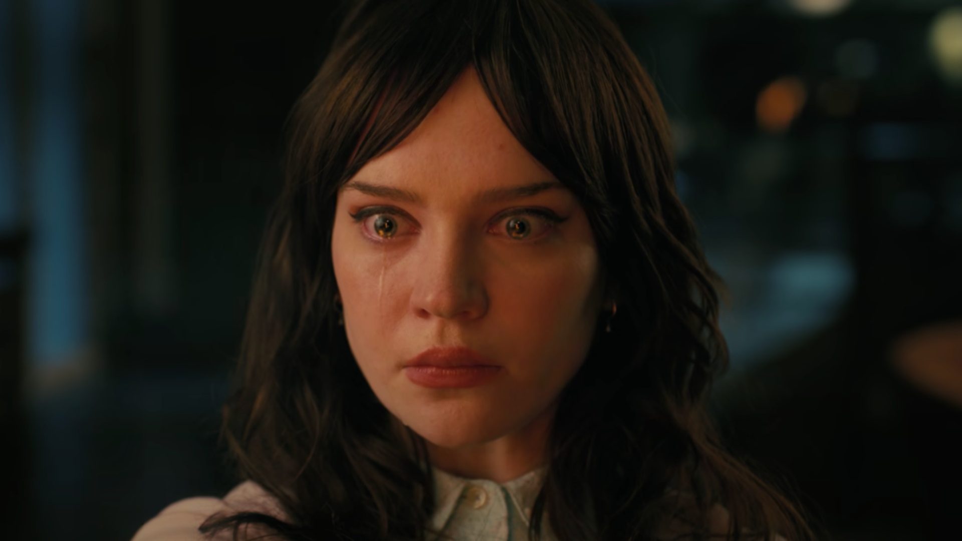 A woman cries as she stares ahead in "Companion."