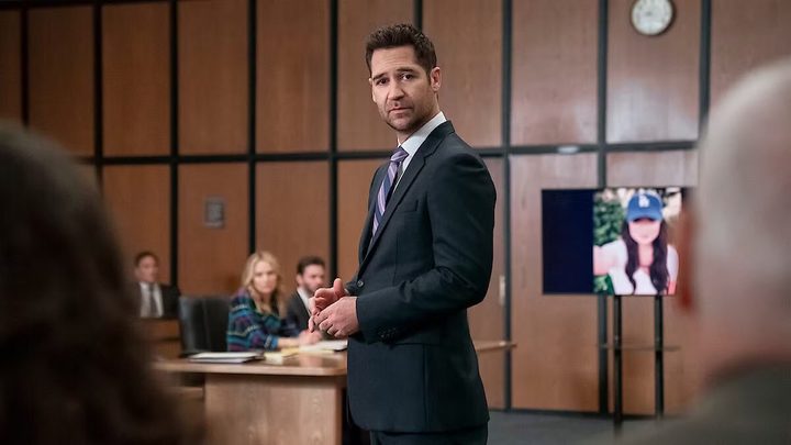 A lawyer stands and stares in court.
