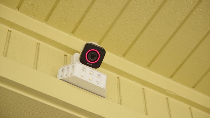 Spotlight Pro and Outdoor Camera Pro mounted on a wall.