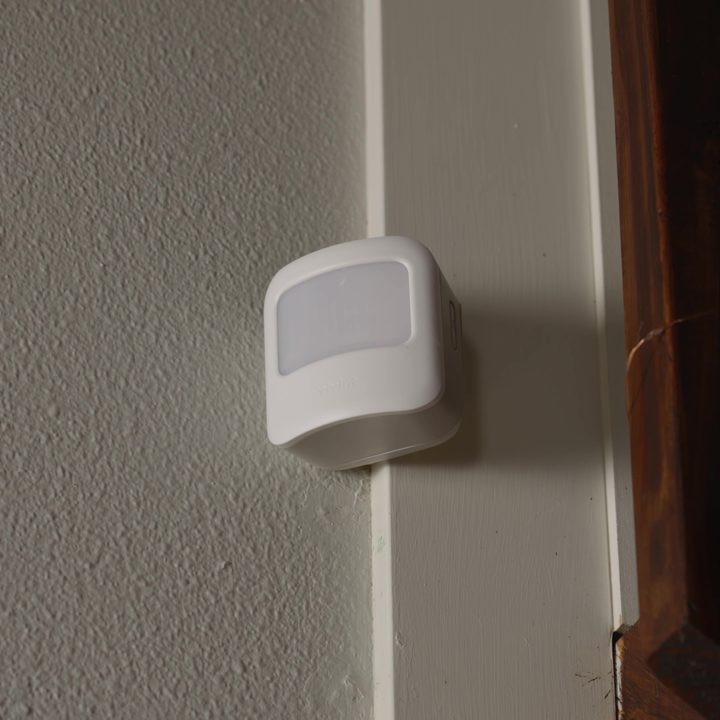 A Vivint motion sensor mounted on a wall.