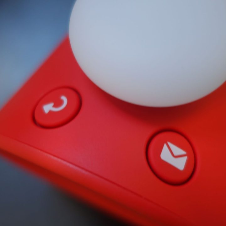 The two top buttons of the Alarmo are shown close up.