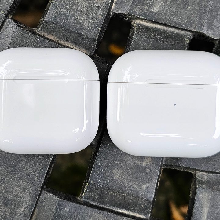 Apple AirPods 4 and AirPods 3 charging cases side by side.
