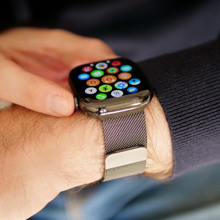 A person wearing the titanium Apple Watch Series 10.