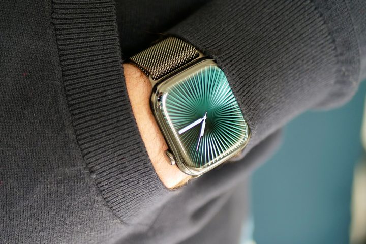 A person wearing the titanium Apple Watch Series 10.