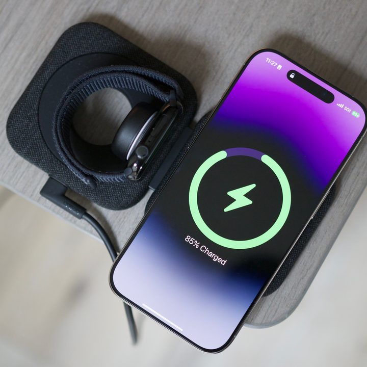 An iPhone and Apple Watch on the Belkin BoostCharge Pro Travel Pad.