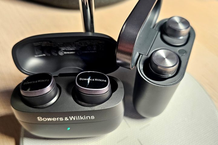 Bowers & Wilkins Pi8 and Pi7 S2 charging cases with lids open.