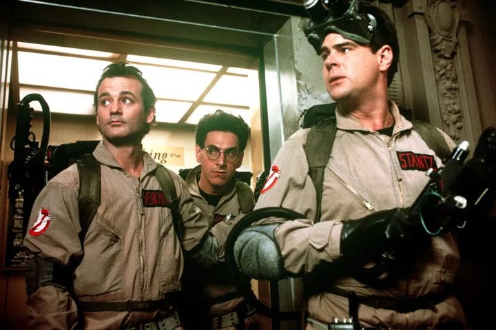 Bill Murray, Harold Ramis, and Dan Aykroyd as the titular Ghostbusters.