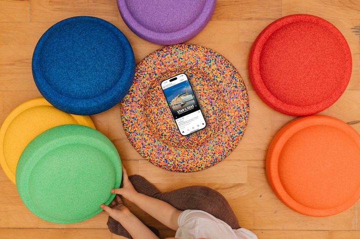 Instagram on iPhone against a colorful background.
