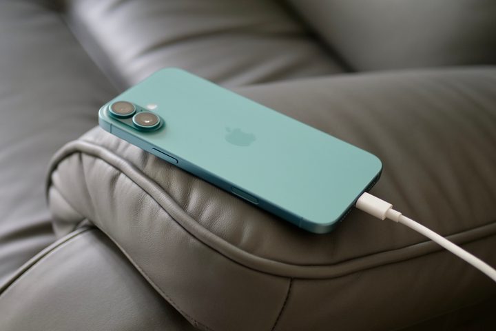The Apple iPhone 16 Plus on charge.