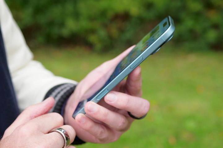 A person using the Apple iPhone 16 Plus.