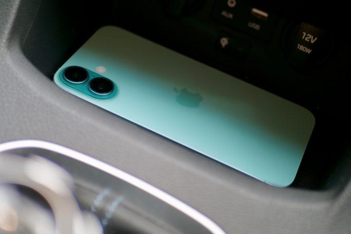 The Apple iPhone 16 Plus on a wireless charger.