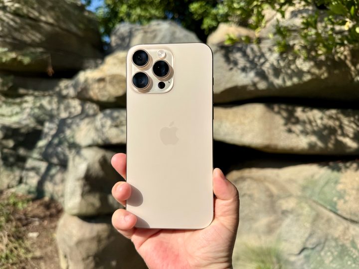 iPhone 16 Pro Max in Desert Titanium.