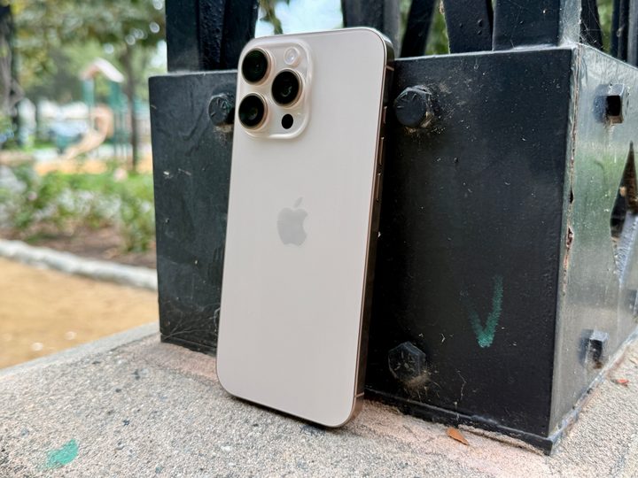 iPhone 16 Pro Max in Desert Titanium.