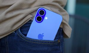 The iPhone 16 sticking out of someone's pocket.