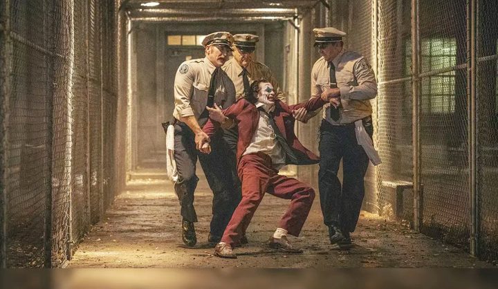 Three guards drag the Joker in Joker: Folie a Deux.
