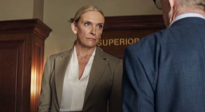 A female lawyer looks sternly at a man in Juror No. 2.