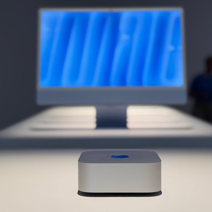 The M4 Mac mini with a display in the background.