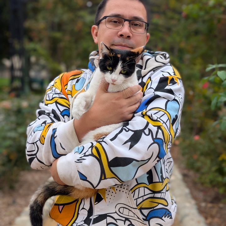 Portrait of man and cat taken with Pixel 9 Pro.