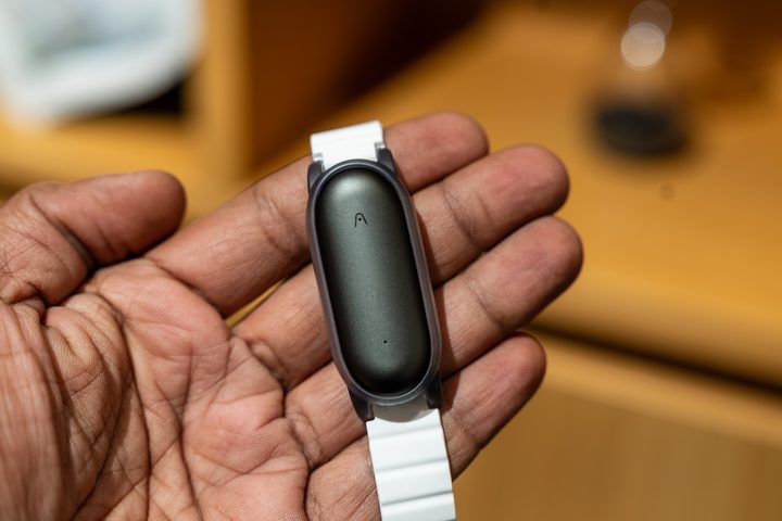 Plaud NotePin in wrist strap in the hand