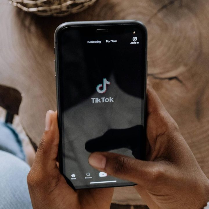 A person using Tiktok on their phone.