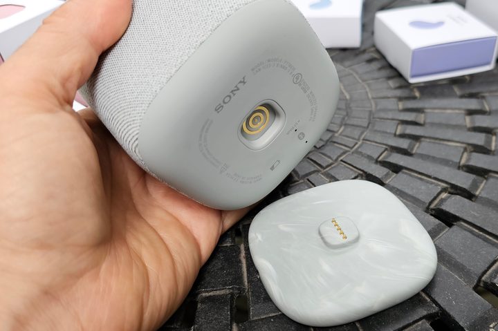 Sony LinkBuds Speaker with wireless charging base.