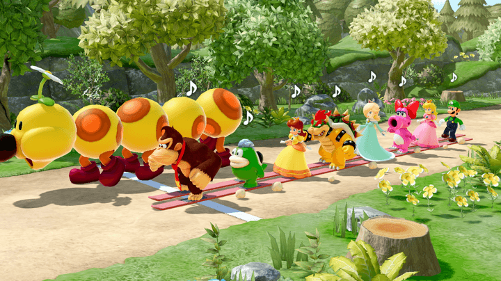 Donkey Kong and friends walk next to a Wiggler in Super Mario Party Jamboree.