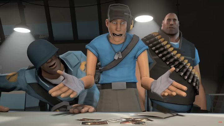 The Scout shocked standing above a table, with the Heavy and Soldier standing behind him.