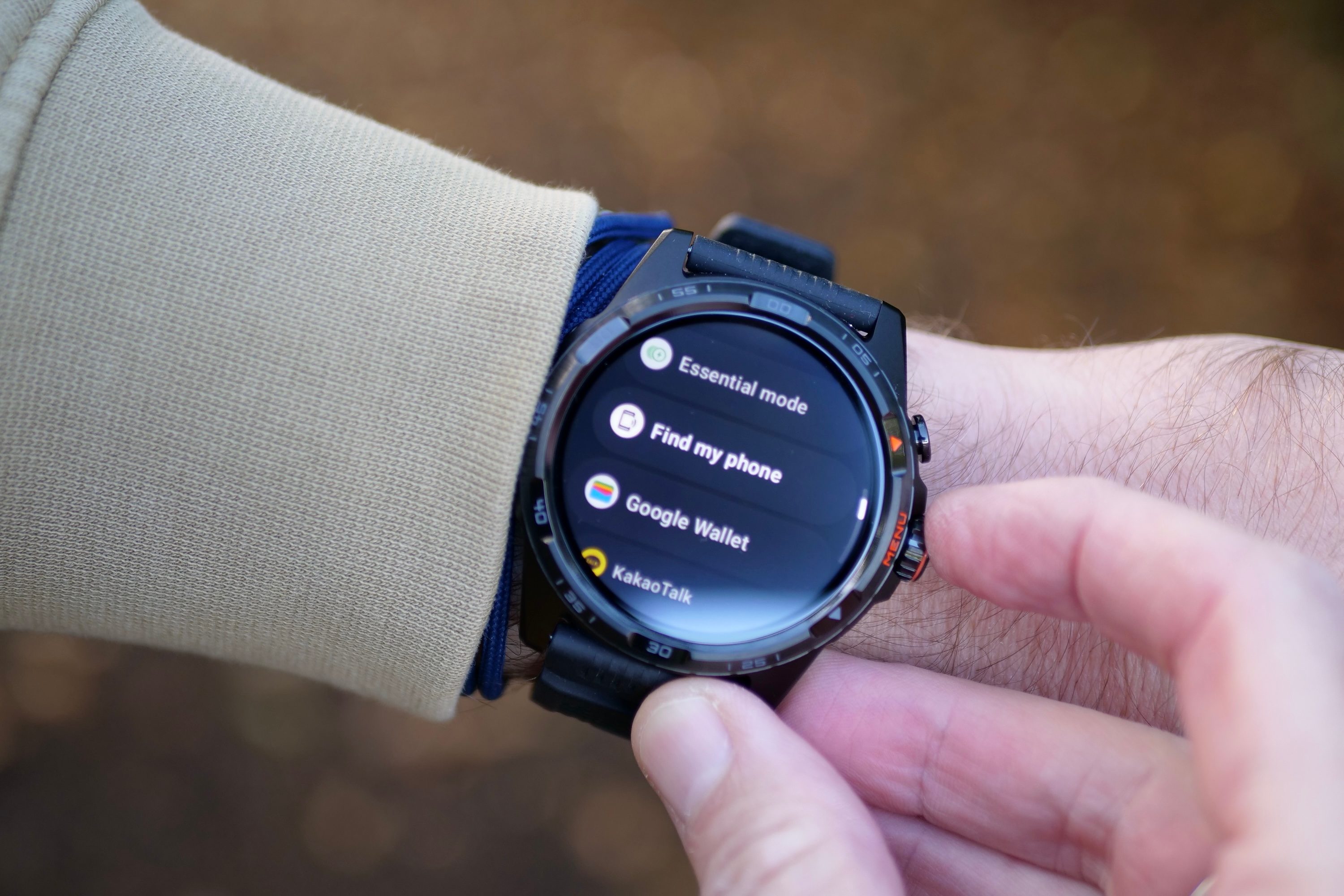 A person wearing the Mobvoi TicWatch Atlas, showing the apps.