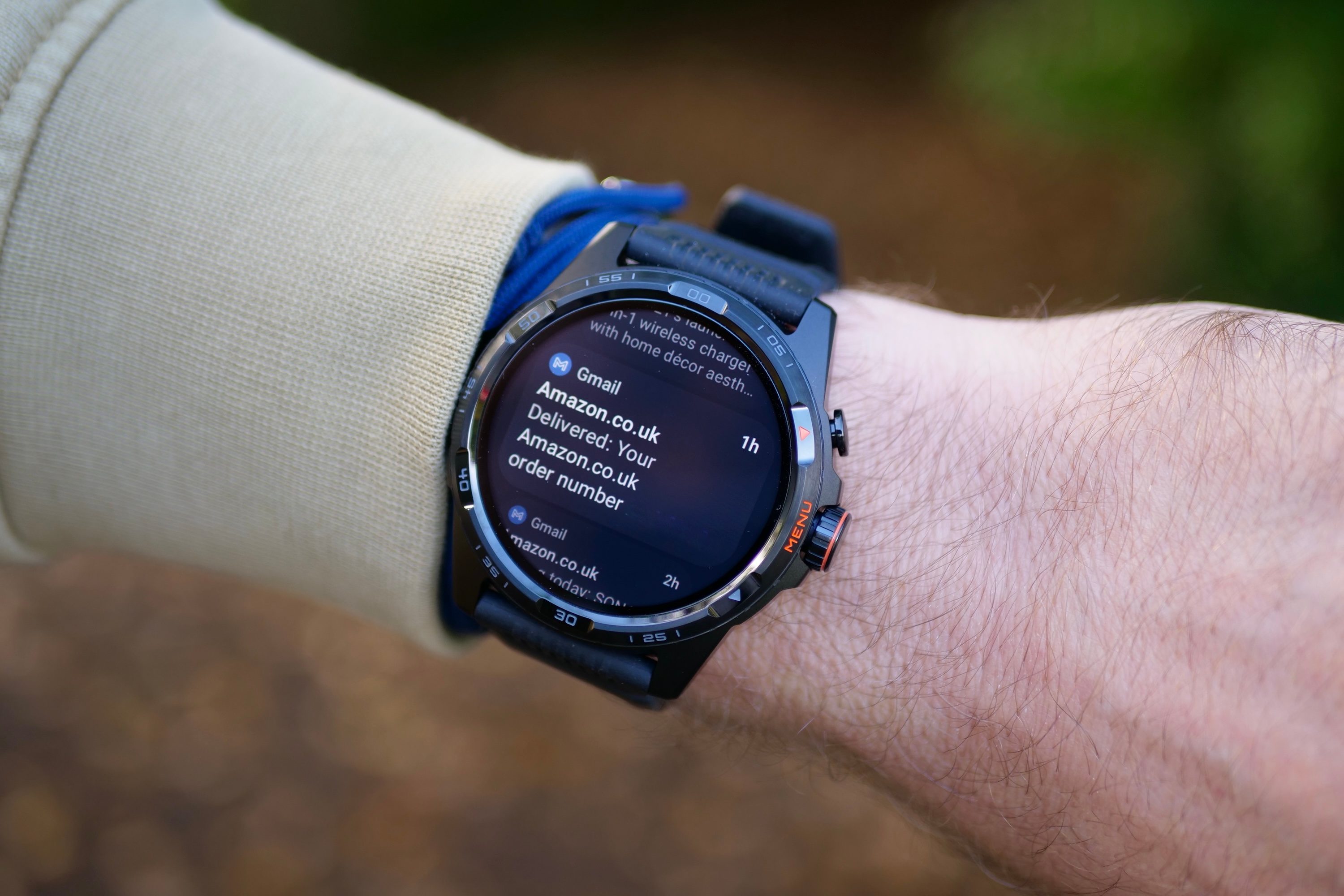 A person wearing the Mobvoi TicWatch Atlas, showing a notification.