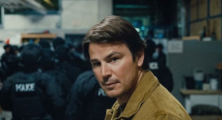 A man looks behind himself in Trap.