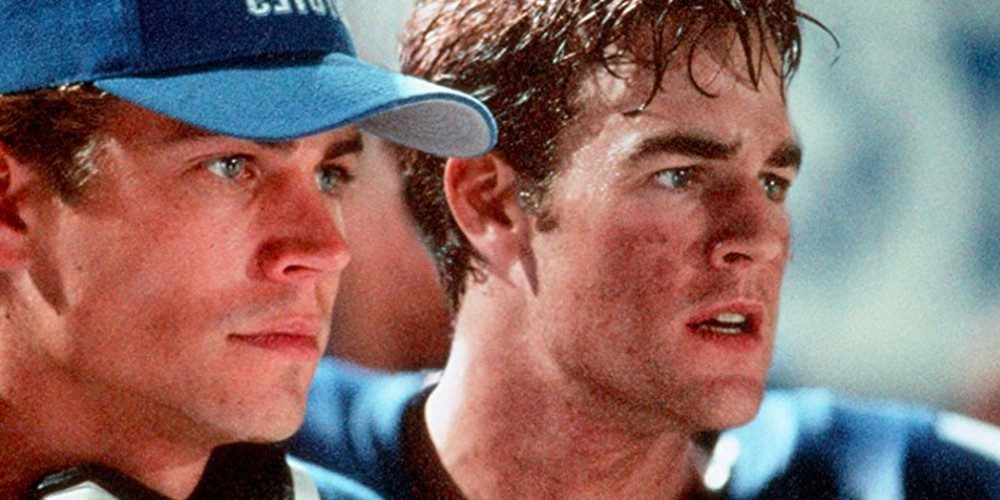 Two football players look ahead in Varsity Blues.