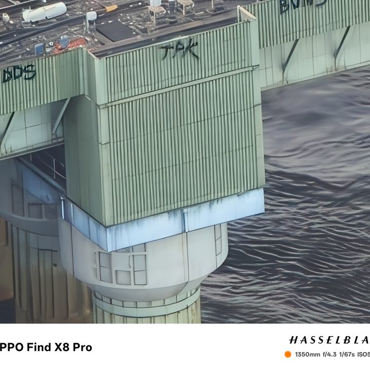Photo taken at 60x zoom on the Oppo Find X8 Pro showing graffiti on the side of a bridge in London.