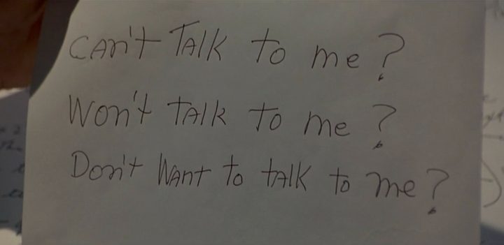 A man holds a faxed message in The Insider.