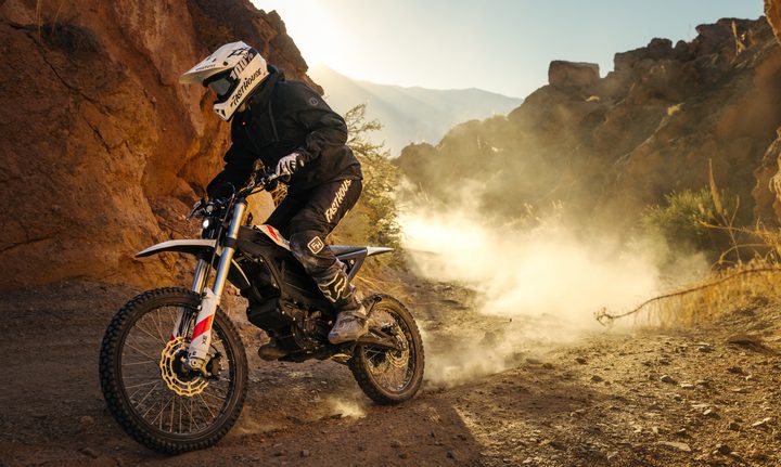 A rider on a Zero XE riding on a rocky mountain trail.