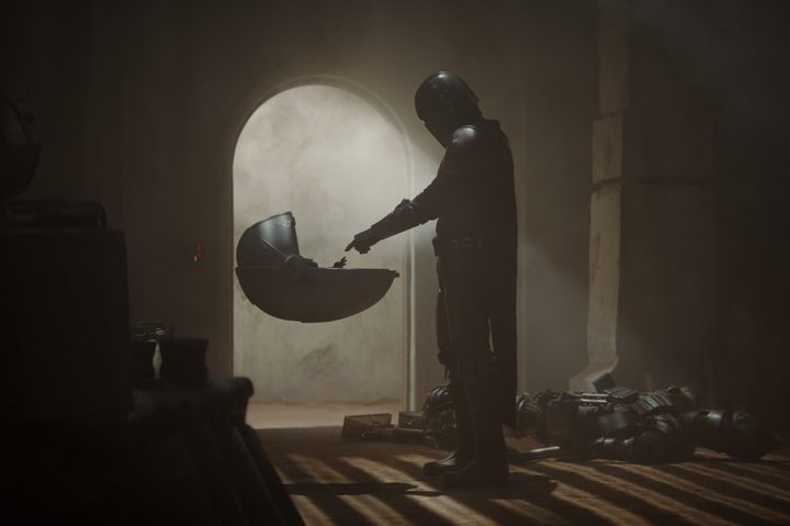 Din Djarin stands in front of Grogu's cradle in The Mandalorian season 1.