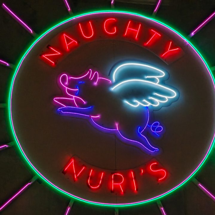 A zoom photo of a neon sign captured on the Find X8 Pro