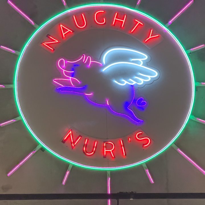 A zoom photo of a neon sign captured on the iPhone 16 Pro