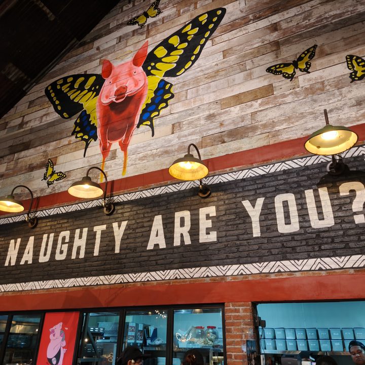 A photo of a mural at Naughty Nuri's BBQ in Bali captured on the Find X8 Pro