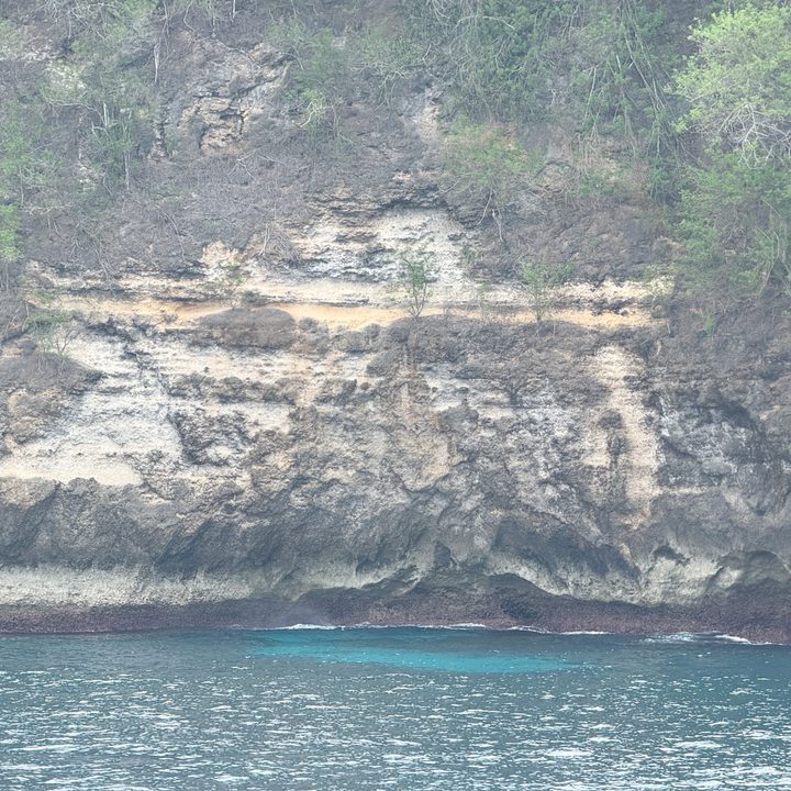 A picture of a cliff face on an island captured on the iPhone 16 Pro