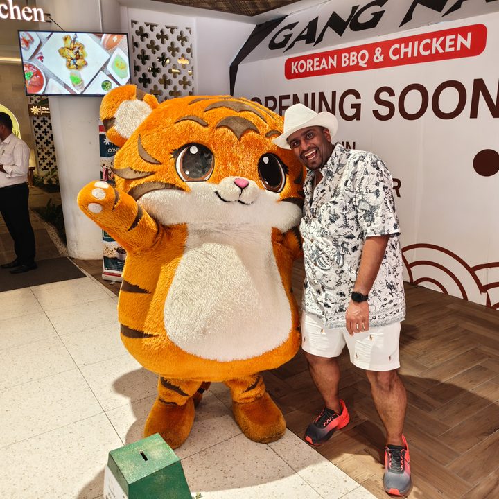 A photo of the author and a big cuddly mascot captured on the Find X8 Pro