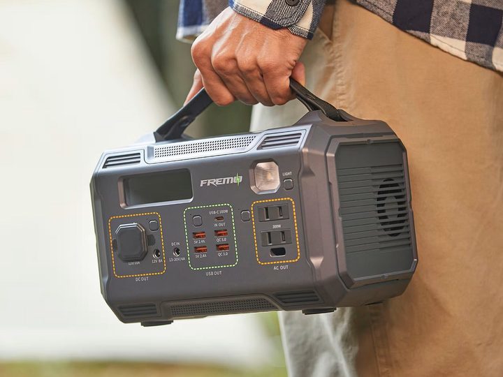 A person carrying the Fremo X300 portable power station.