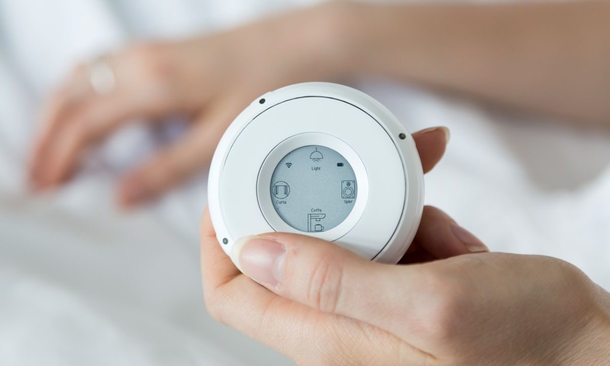 A person holding the Linxura Smart Controller
