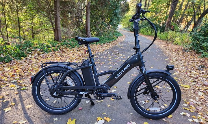 Lectric ONE e-bike right profile view on a leafy lane.